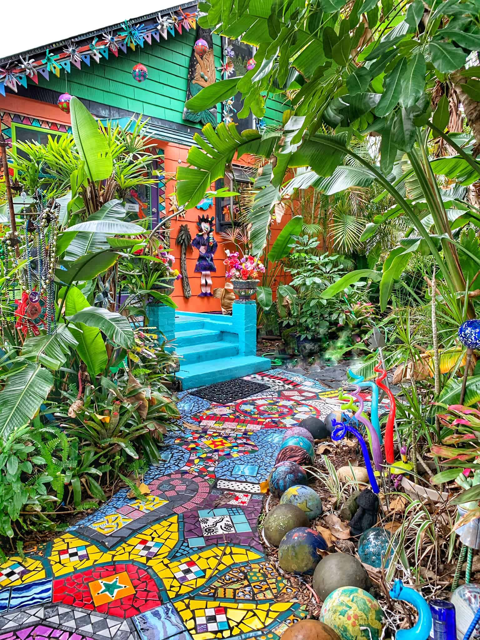Colorful pathway around Whimzeyland, with corner of the brightly colored house visible