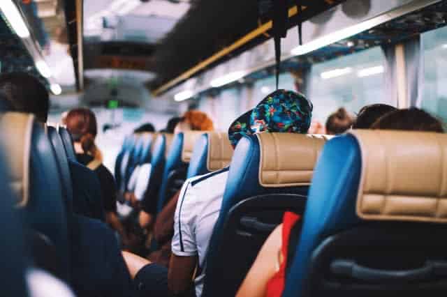 People sitting in seats on a bus