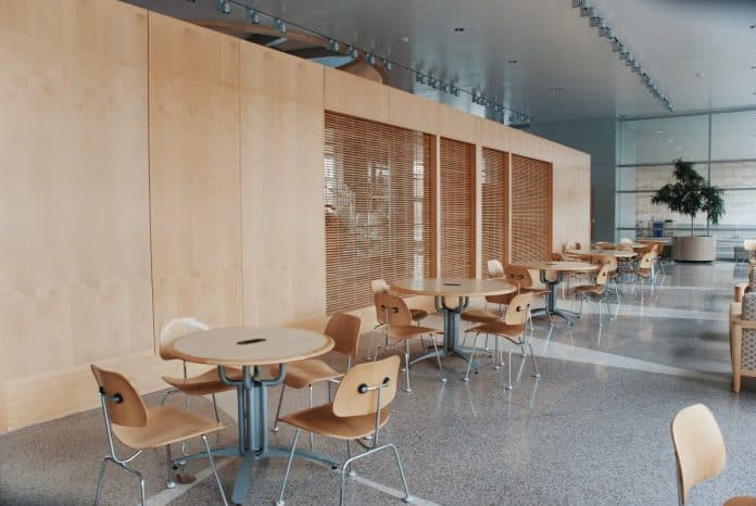Cafeteria with round tables and chairs