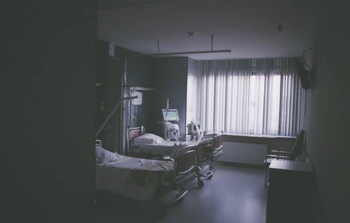 Low exposure shot of a hospital room with two beds in it