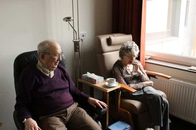 Older couple sitting in chairs
