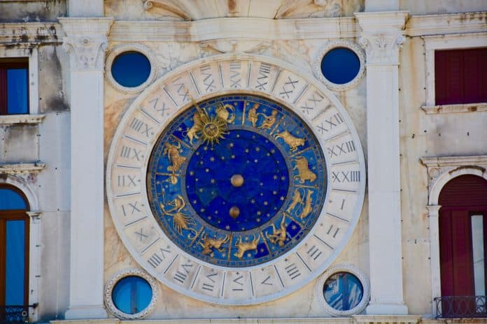 Large stone and marble display showing all the zodiac signs, with a dial showing the current one