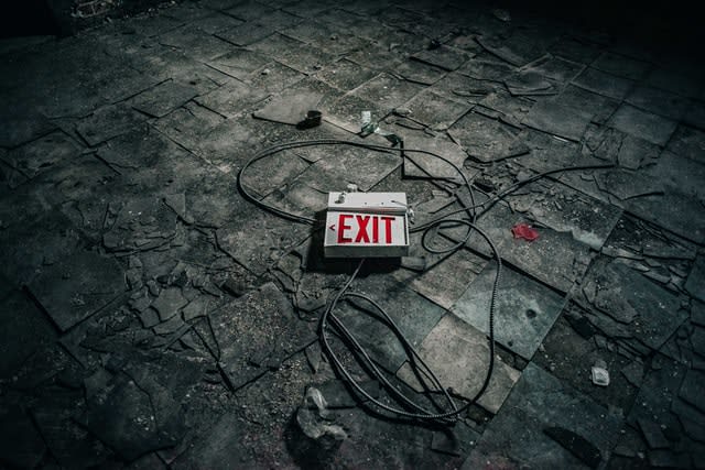Exit sign laying in rubble