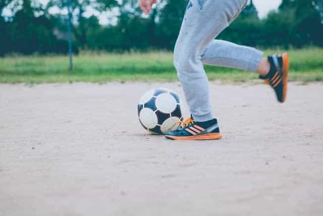 Kid playing with soccer ball