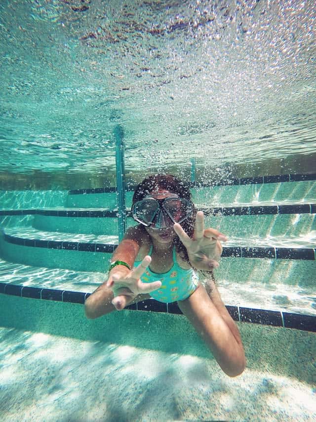 Girl underwater with snorkel