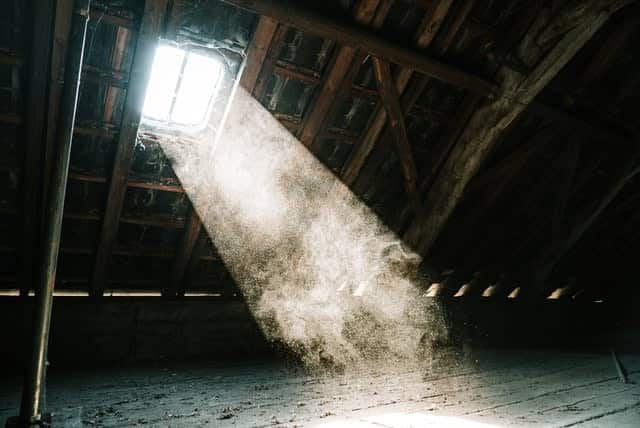 Sun coming in through dusty attic window