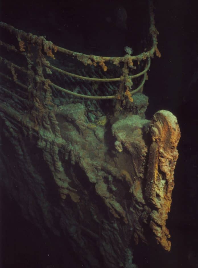 Sunken bow of ship, covered in rust and barnacles