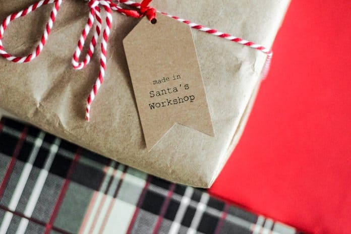 Paper bag wrapped package saying 