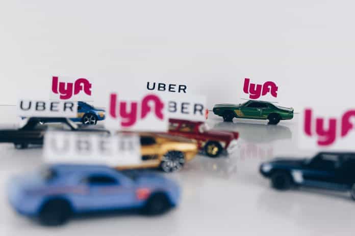 Toy cars with Lyft and Urber signs on top