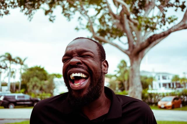 Man laughing outside